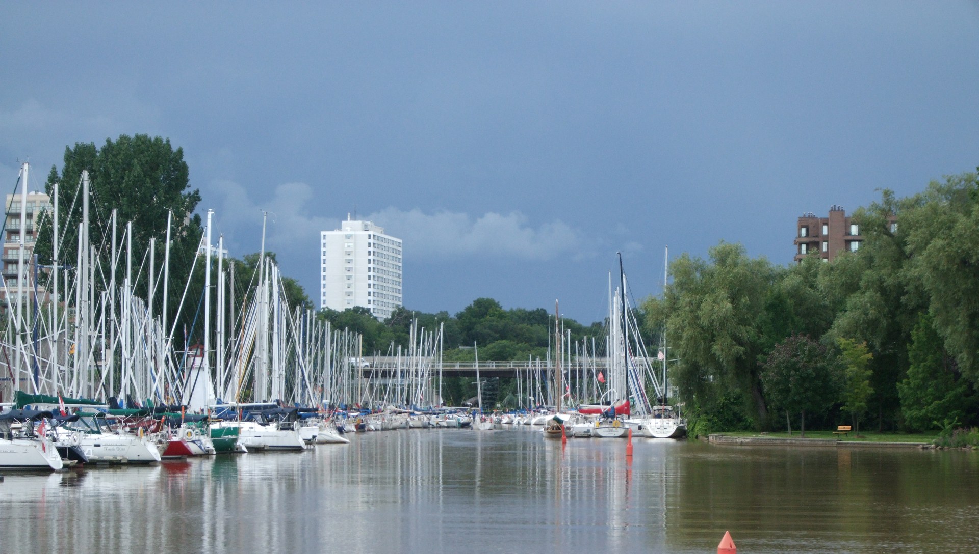Sailboats moored in Oakville harbour in the evening